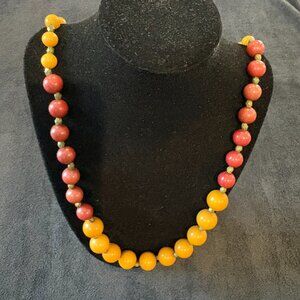 Vintage beaded necklace in gold, green and red, lobster claw clasp, 34"